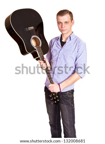 A man holding a guitar