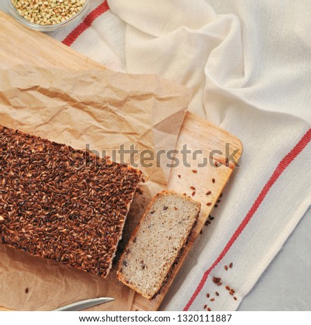 Useful home-made vegan sourdough bread from green buckwheat with flax and sunflower seeds. Raw healthy and proper nutrition
