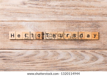 hello thursday word written on wood block. hello thursday text on wooden table for your desing, concept.