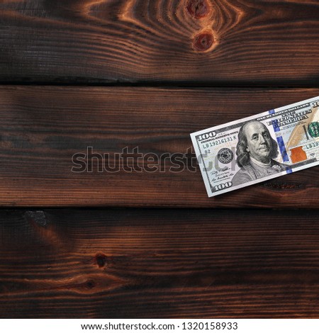 Dollars on a wooden background. Money