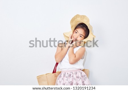 Summer Shopping little girl holding bag on white studio background, Fashion, sale, shopping concept, big sale