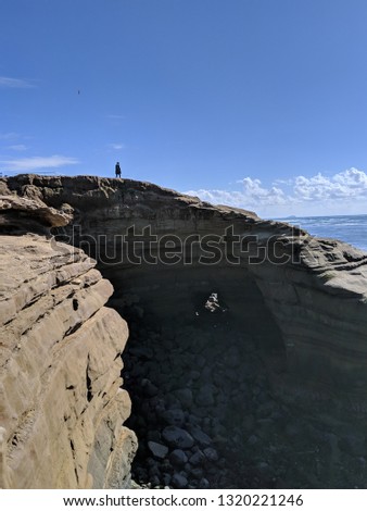 person on sunset cliffs san diego