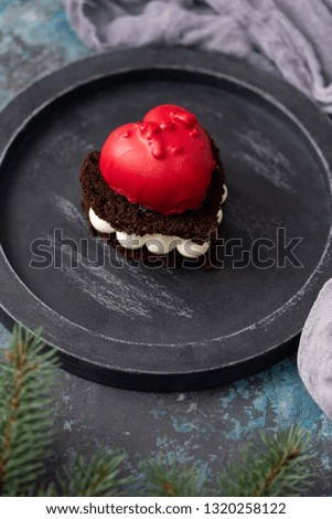 Delicious chocolate cake in heart shape on dark background– stock image