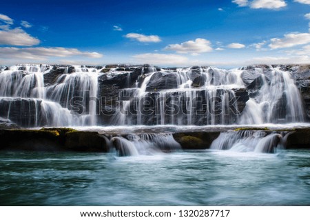 Beautiful waterfalls and morning sun with bright sky days