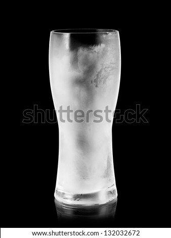 Empty frozen beer glass on black background