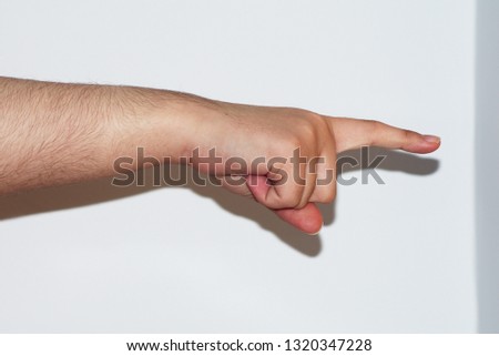 Young caucasian male's hand signaling to the right