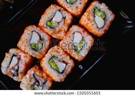 Traditional Japanese sushi roll black background