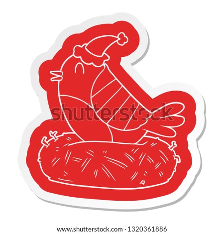 quirky cartoon  sticker of a bird sitting on nest wearing santa hat