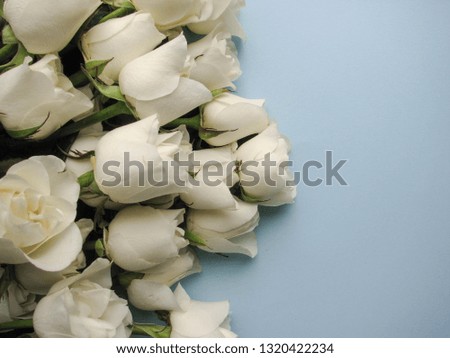 romantic composition. bouquet of flowers and an envelope on a blue background. invitation. congratulation. wedding