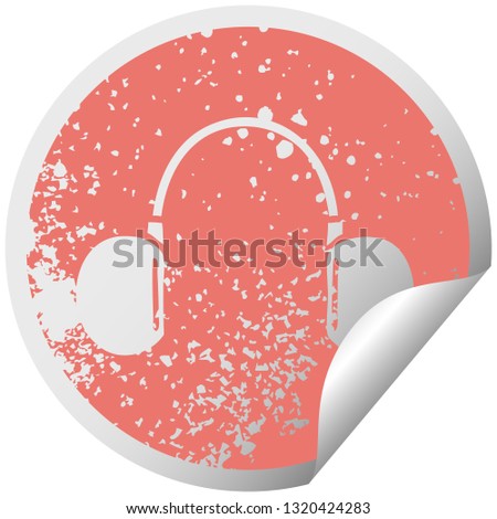distressed circular peeling sticker symbol of a retro headphone