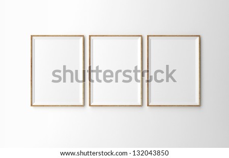 three wooden frames on white wall Royalty-Free Stock Photo #132043850
