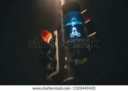 Traffic light with green bycicle color at dusk