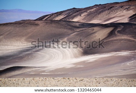 Volcano; sandy foreground; unusual texture, color of the mountains; travel photography