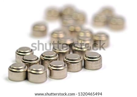 Hearing aid batteries in front of white background Royalty-Free Stock Photo #1320465494