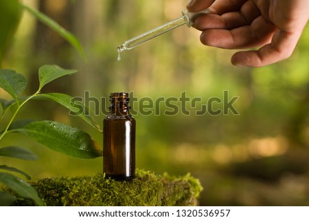 Natural remedies, aromatherapy - pipette & bottle. Organic alternative medicine, amber bottles. Royalty-Free Stock Photo #1320536957