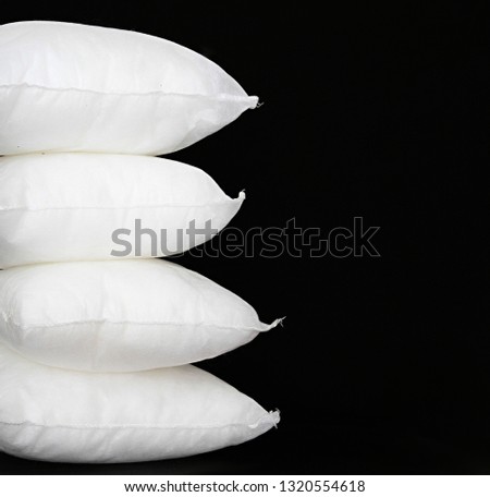 cushion pad inserts sitting on a table with black background no people stock photography stock photo