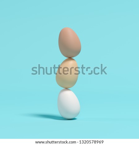 Stacked eggs on blue background. Minimal Easter concept idea.