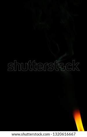 Flame and smoke on a black background