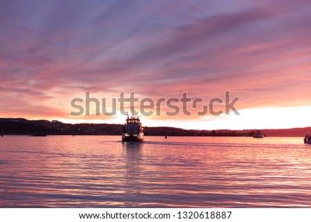 View of sailing ship at Oslo Harbour, Oslo Norway. Seen in the evening with beautiful twilight sunset.  Travel in Europe concept.