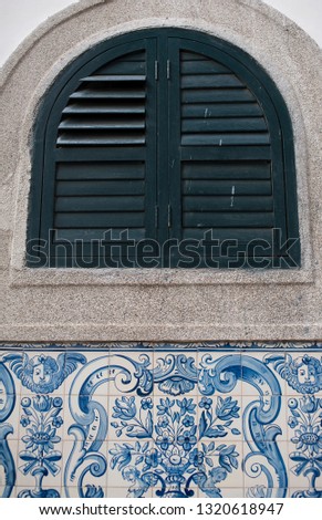 Antique window and decorative facing tiles with a pattern based on the old Portuguese patterns.