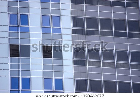 modern multi-storey building, skyscraper. construction of a glass house. a large number of residential and commercial areas. Urban city