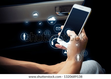 man use snartphone on car with connect network concept with ai ui icon data