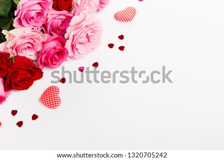 Festive pink flower rose with hearts composition on white background. Overhead top view, flat lay. Copy space. Birthday, Mother's, Valentines, Women's, Wedding Day concept.
