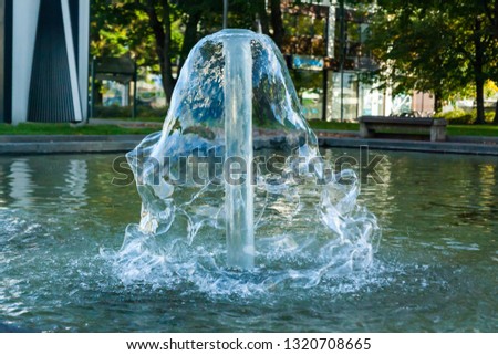 Short exposure photo of a fountain in shape of cone in Kouvola, Finland on a summer day.