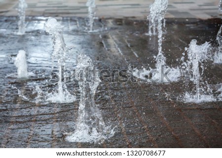 Short exposure photo of a few small fountains in Kouvola, Finland on a summer day.