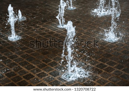 Short exposure photo of a few small fountains in Kouvola, Finland on a summer day.