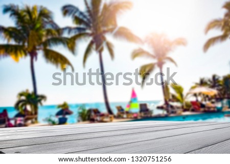 Summer table of free space for your decoration and coco palms background on beach on Madagascar. 