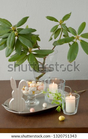 Easter table decor with spring flowers and festive tableware