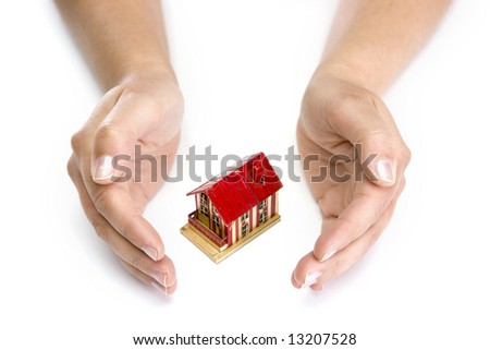 woman hands with small house - real state concept