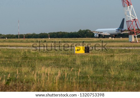 Arriving flight at the airport in summer season.