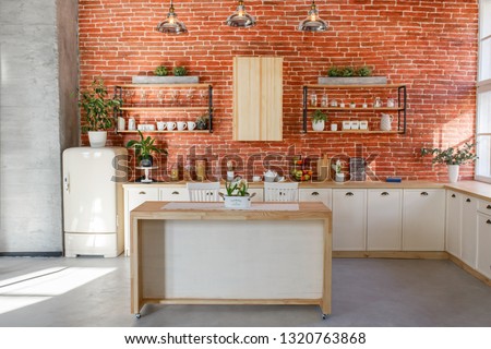  Retro kitchen in a cottage with red brick wall. Studio inretior. Spring kitchen  Royalty-Free Stock Photo #1320763868