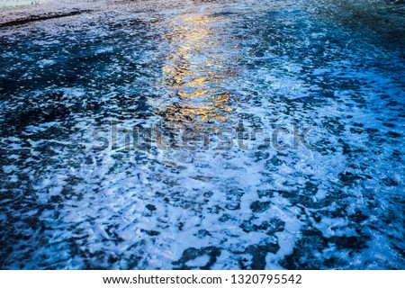 
Frozen road. Ice on asphalt