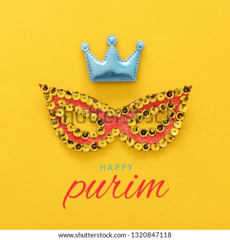 Purim celebration concept (jewish carnival holiday). mask shape cutted from paper