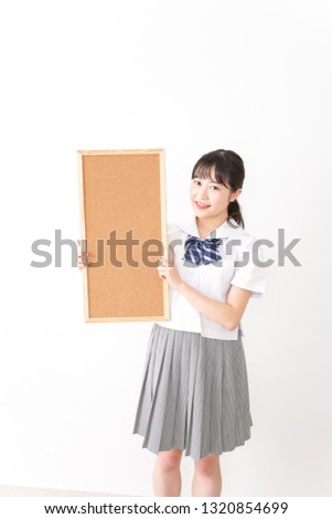 Young woman holding a board