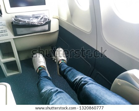 Picture shows the place for legs in the business class of the airplane. Great for long flights as the space is very big. 