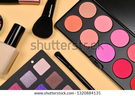 Professional makeup products with cosmetic beauty products, foundation, lipstick,  eye shadows, eye lashes, brushes and tools.