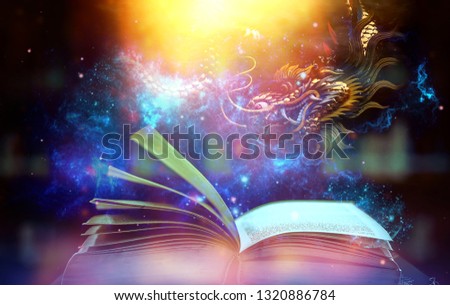 Magic book with light and shine An amazing story book with stars, and magic dragons. And sparkling lights on the background