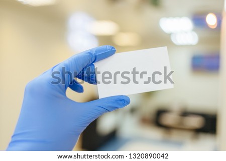 business card in the hands of a doctor
