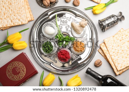 Flat lay composition with symbolic Passover (Pesach) items on color background Royalty-Free Stock Photo #1320892478