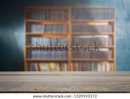 Table on the background of the bookcase