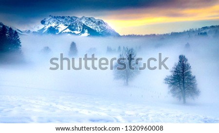 mountain outshines the fog on snowy land travel winter wonderland bavaria