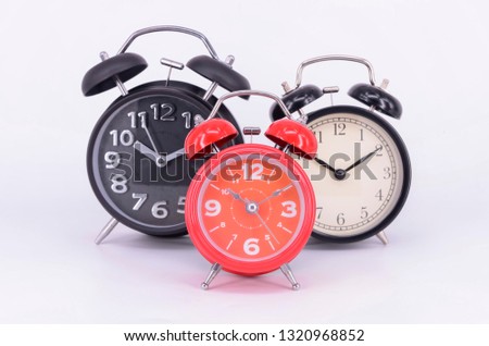 Alarm clock isolated on white background. Selective focus.