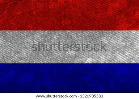 Flag of the Netherlands of thick rough denim. Backgrounds and Textures.