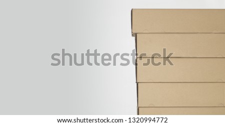 a few brown cardboard boxes with a room for your topic