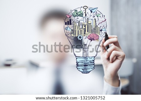 Hand drawing business idea concept on office background.