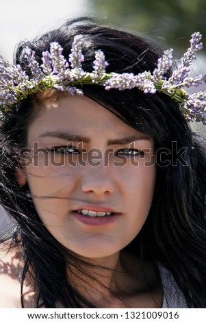 beautiful green-eyed girl with lavender crown